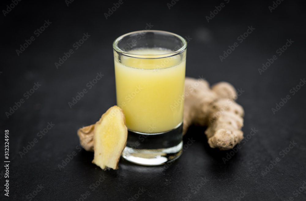Portion of Ginger Juice as detailed close-up shot; selective focus Portion of Ginger Juice as detailed close-up shot; selective focus
