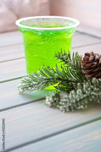 green fruit jelly on glass, vertical image