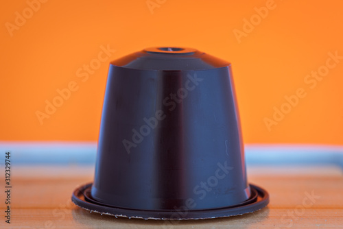 closeup lateral view of an aromatic, tasty espresso coffee capsule