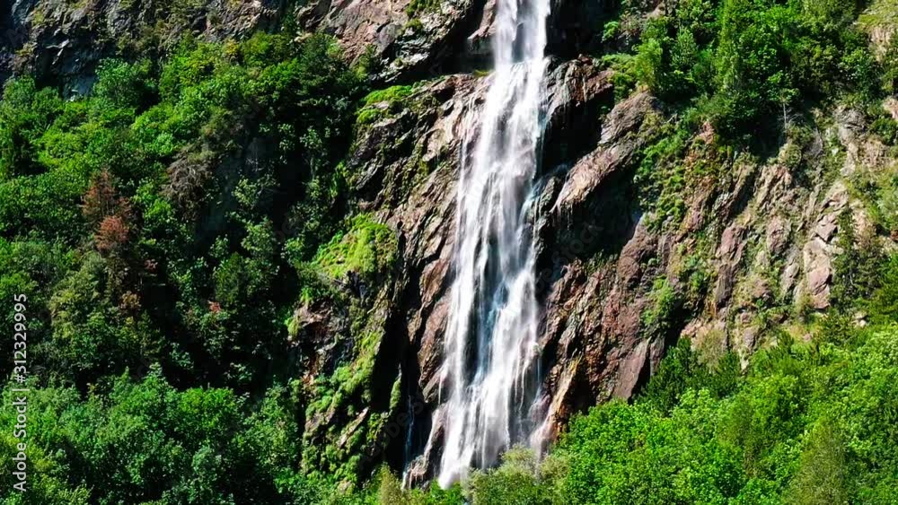 close to a waterfall in the swiss alps close to a waterfall in the swiss alps