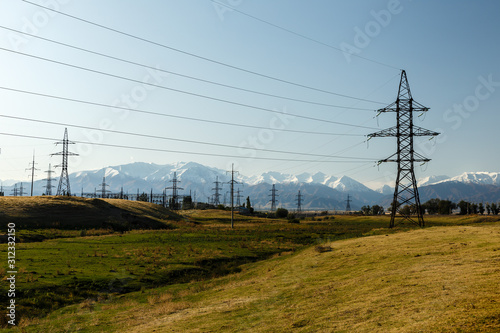 high-voltage power line in the mountains, electric high voltage power post, Kyrgyzstan
