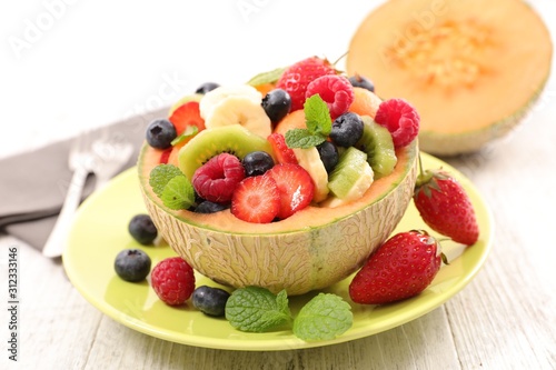 fresh fruit salad in melon bowl