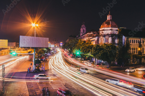 Cityscape of downtown in Yangon at night with traffic light 