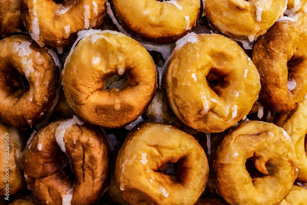Many sweet donuts pyramid folded. texture donuts food pattern design Many sweet donuts pyramid folded. texture donuts food pattern design