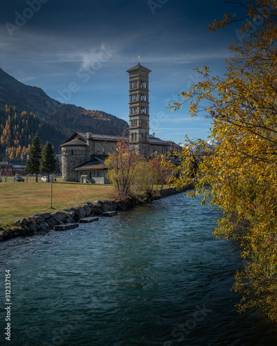 Kirche St. Karl Borromäus im goldenen Herbst am St. Moritzersee photo