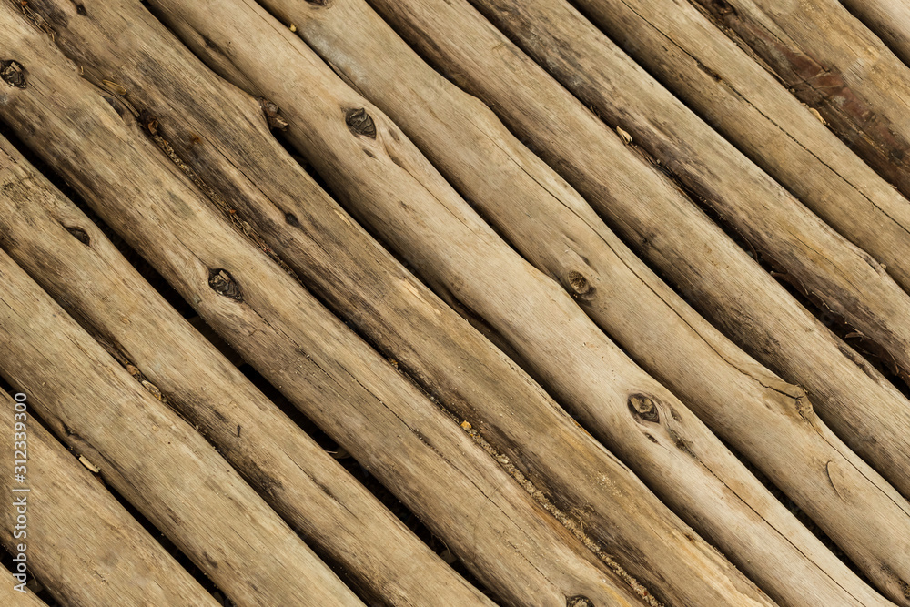 wooden background thin uneven gray background parallel oblique trunks weathered