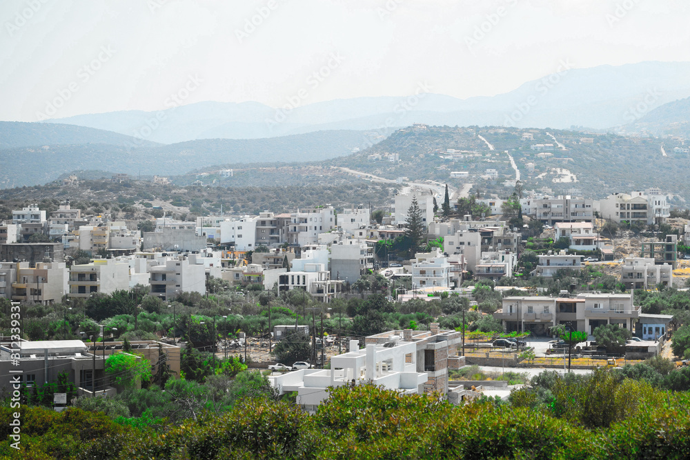 Greek village panorama from hill white houses background of the mountains sunny day