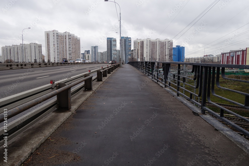 high-rise housing over a bridge in moscow butyrski district on overcast day