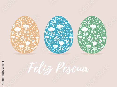 Happy Easter-Feliz Pescua, Spanish Easter Wishes. Cute Eggs in 3 Diferent Colors Isolated on a Beige Background. Pale Yellow, Blue and Green Eggs with and White Hand Drawn Floral Ornament Inside. 