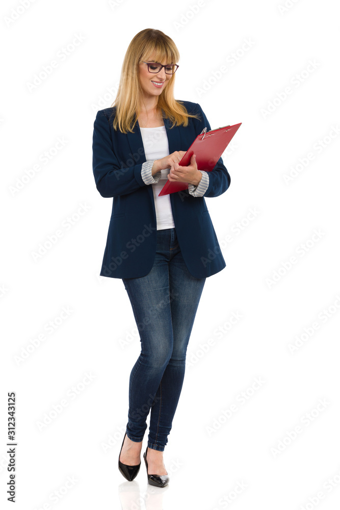 Young Businesswoman Is Standing With Clipboard And Checking List
