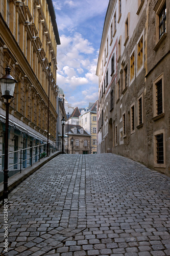 narrow street in the old town, paving, perspective, uphill road, cityscape