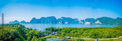 Scenic panoramic natural landscape view of Ko Chong Lat Island ,beautiful tropical Andaman sea ,Green lush of mangrove forest from Laem Sak Buddhist Temple (Wat Leam Sak) in Ao Luek ,Krabi ,Thailand photo