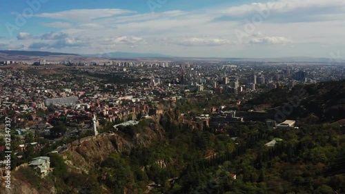 Aerial view of Tbilisi city and monument Mother of Georgia drone footage. photo