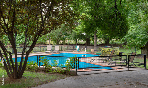 Blue pool and green trees