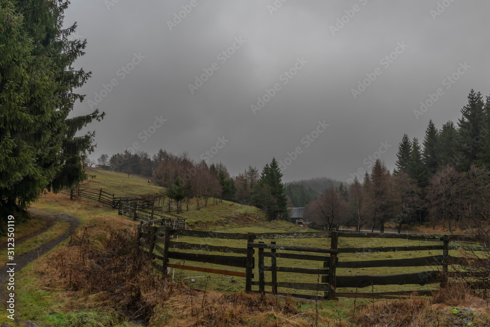 Pasture land in Krusne hory mountains in winter cloudy evening Pasture land in Krusne hory mountains in winter cloudy evening