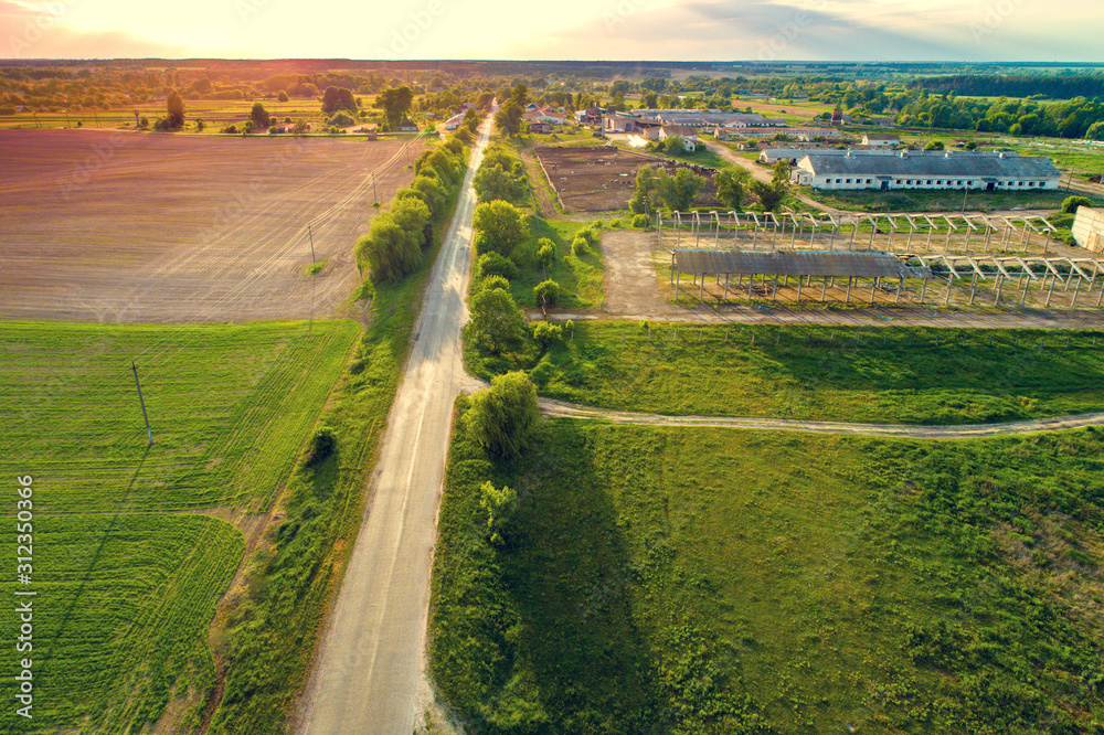 Aerial view of the countryside. The direct country road along the field