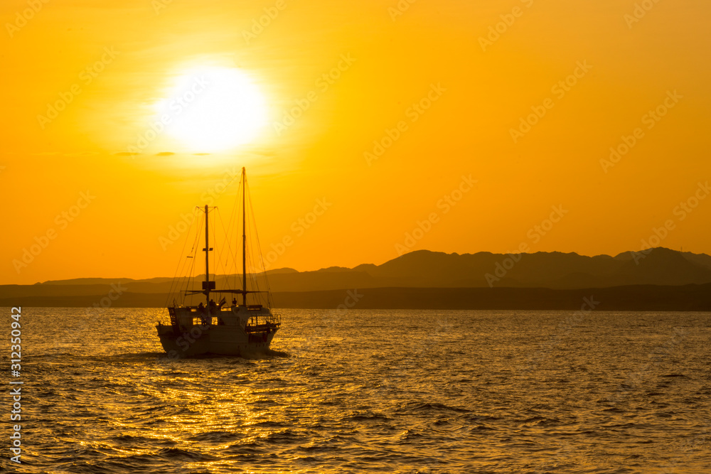 Sunset at sea. toned. Yacht in the sunset. copy space