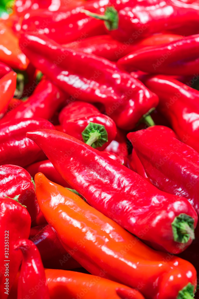 red peppers. Raw vegetables and fruits background. Healthy organic food concept. A group of fresh and clean red peppers. vertical photo red peppers. Raw vegetables and fruits background. Healthy organic food concept. A group of fresh and clean red peppers. vertical photo