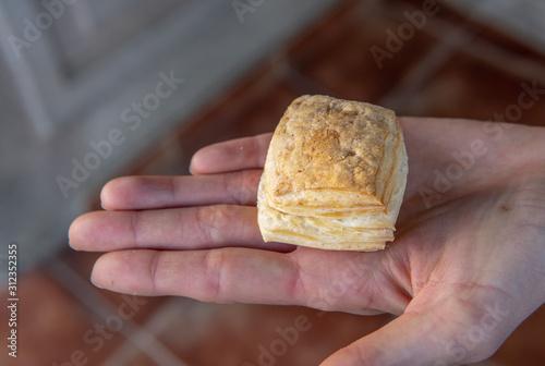 Argentine Pastry being held in women's hand photo