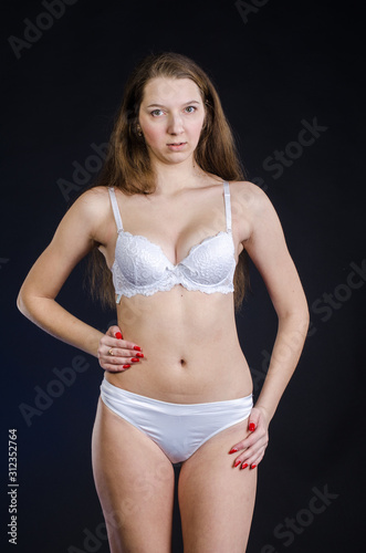 Sexy girl in lingerie on black background studio