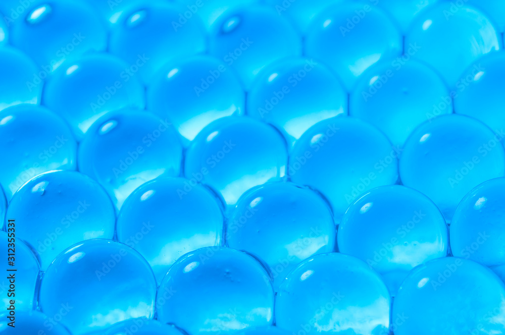 Fototapeta premium Texture of blue gel balls with blur