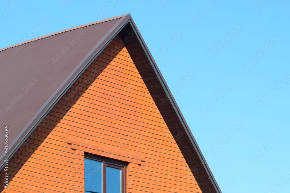 House with a roof made of metal sheets House with a roof made of metal sheets