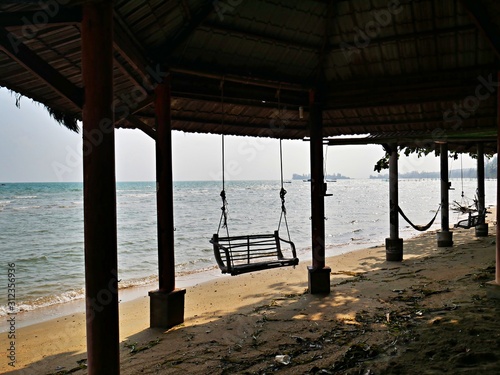 selfmade swing on the beach