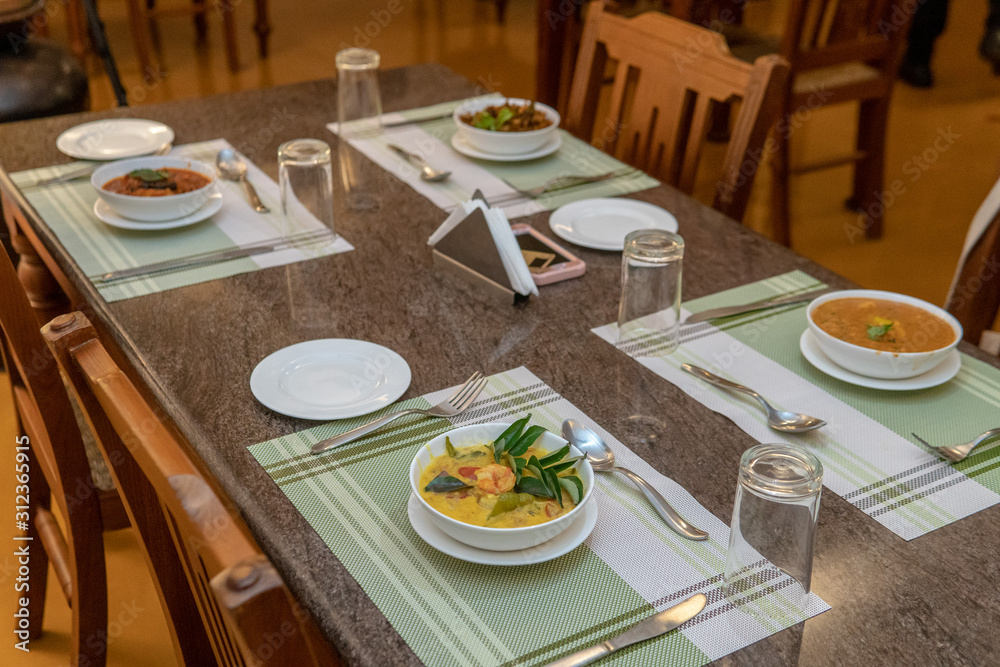 Variety of Indian curries served on table Variety of Indian curries served on table