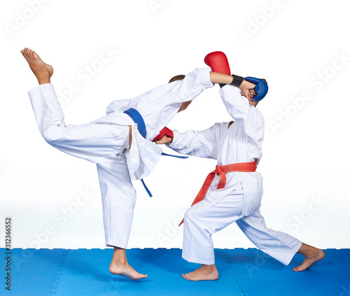 A boy with a blue belt beats punch in jump