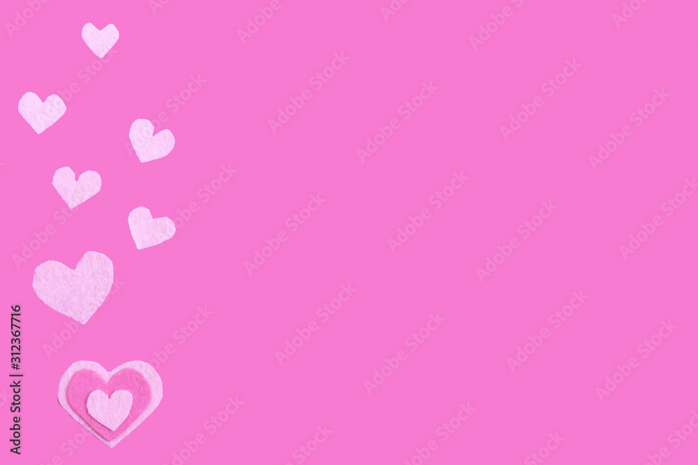 Felt hearts on the pink background. Copy space. Place for text and design. Valentine's day