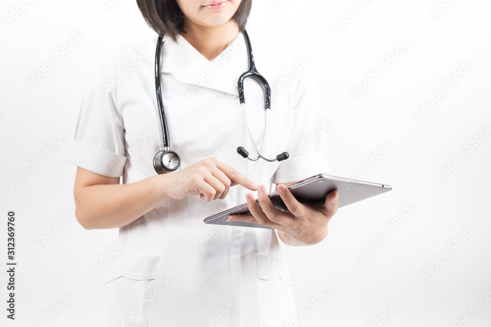Young asian nurse with a stethoscope using a digital tablet, isolated over white background. Young asian nurse with a stethoscope using a digital tablet, isolated over white background.