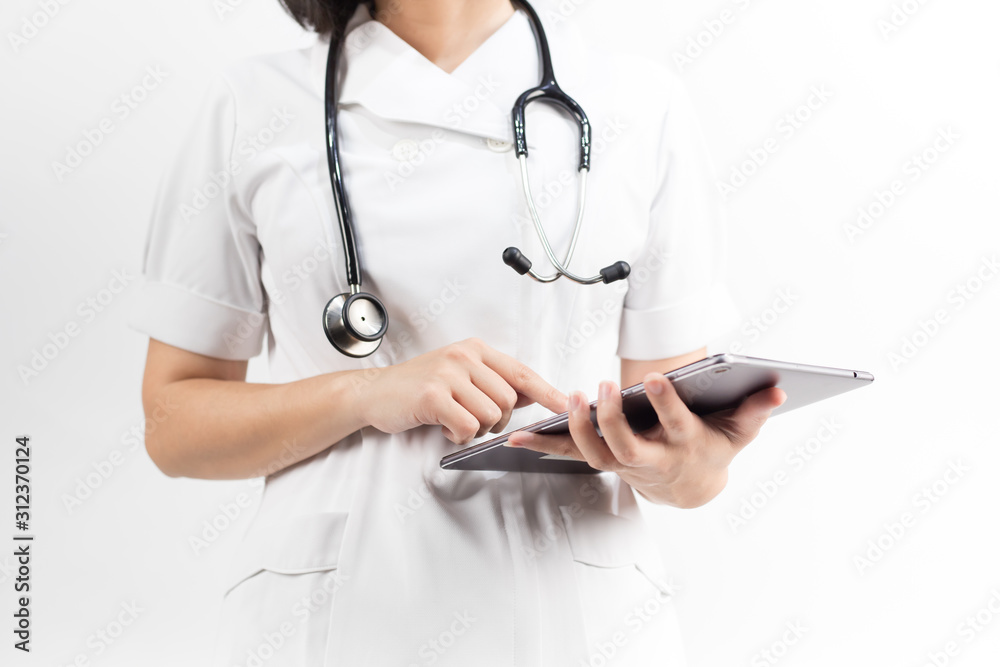 Young asian nurse with a stethoscope using a digital tablet, isolated over white background. Young asian nurse with a stethoscope using a digital tablet, isolated over white background.