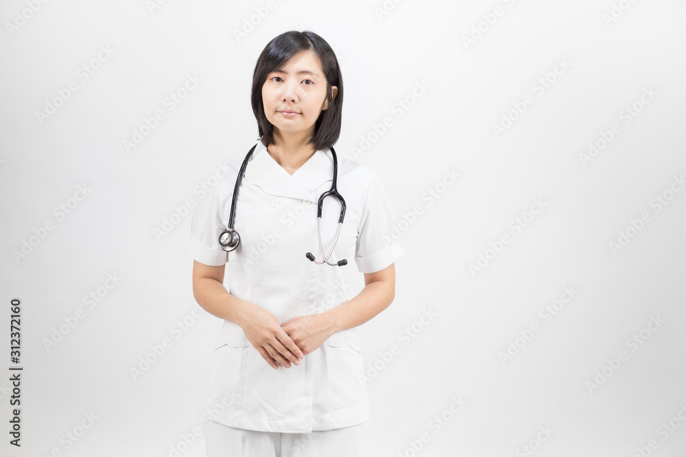 Young asian nurse with a stethoscope isolated over white background. Young asian nurse with a stethoscope isolated over white background.