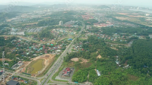 4K Aerial Drone Footage Of daily lifestyle of local people during morning at Menggatal Town, Sabah, Malaysia photo