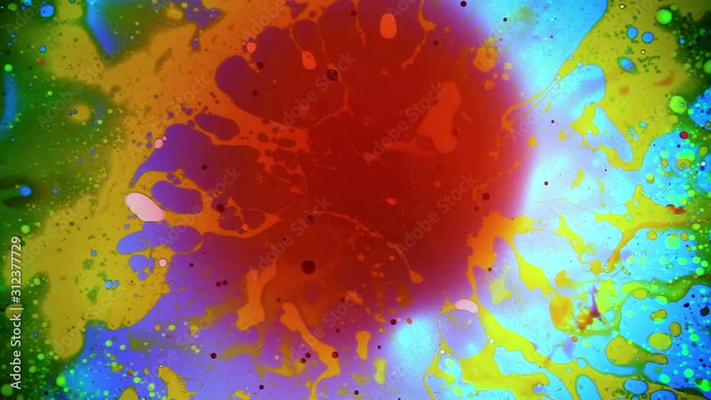 Abstract colorful paint reactions. Psychedelic liquid light show, dye curlicues. Marble background for visual effects, motion graphics. Swirl pattern, ink explosion, kaleidoscope. 60s disco oil wheel.