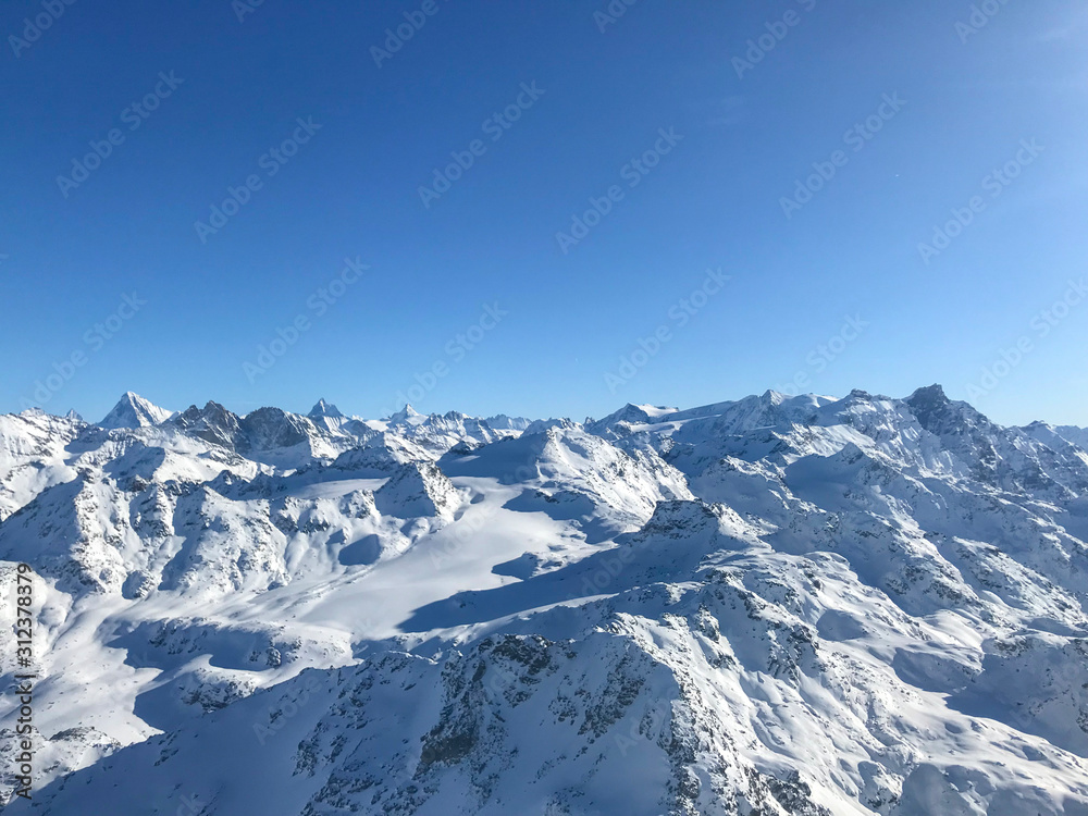 View of the alpes in winter covered in snow