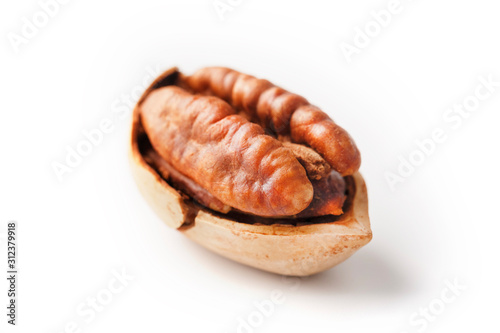 Pecan isolated on white background. Close-up, macro. A nut in a shell.