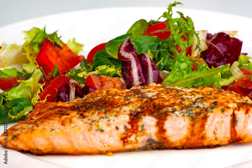 grilled salmon steak with vegetables and sauce grilled salmon steak with vegetables and sauce