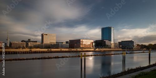 long exposure of the   berseestadt in Bremen  Germany with office buildings and cloudy sky during sunrise