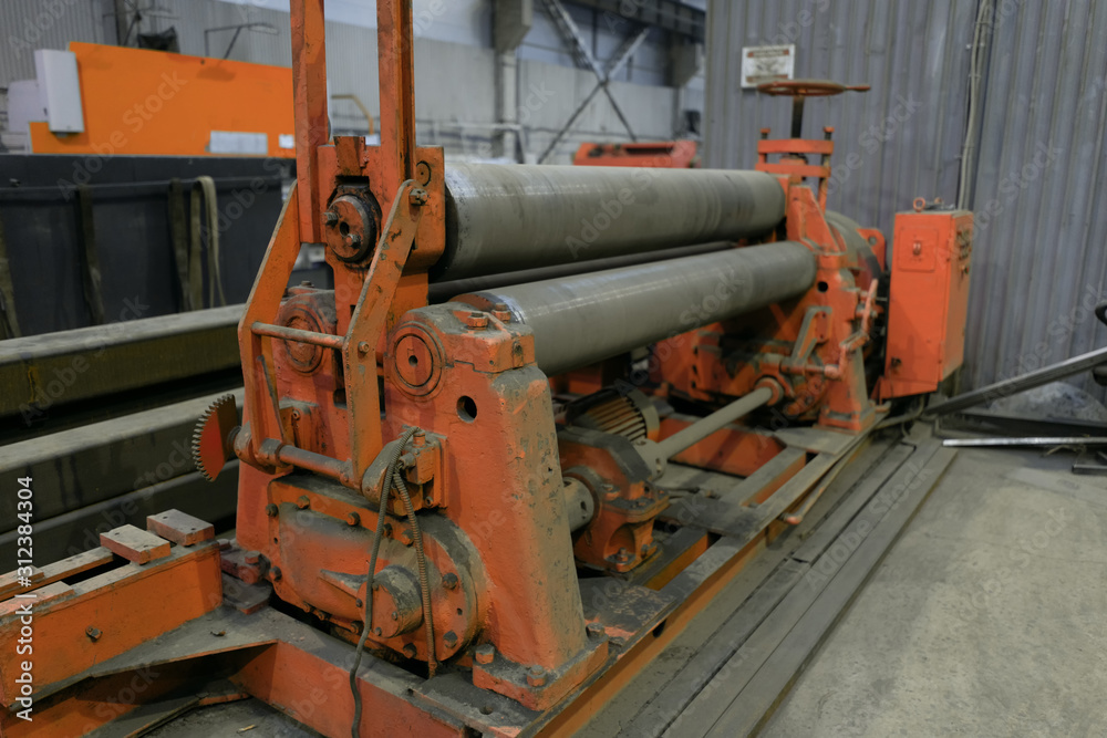 Factory equipment. Bending machine made of shafts. old manual machine tool. Factory equipment. Bending machine made of shafts. old manual machine tool.