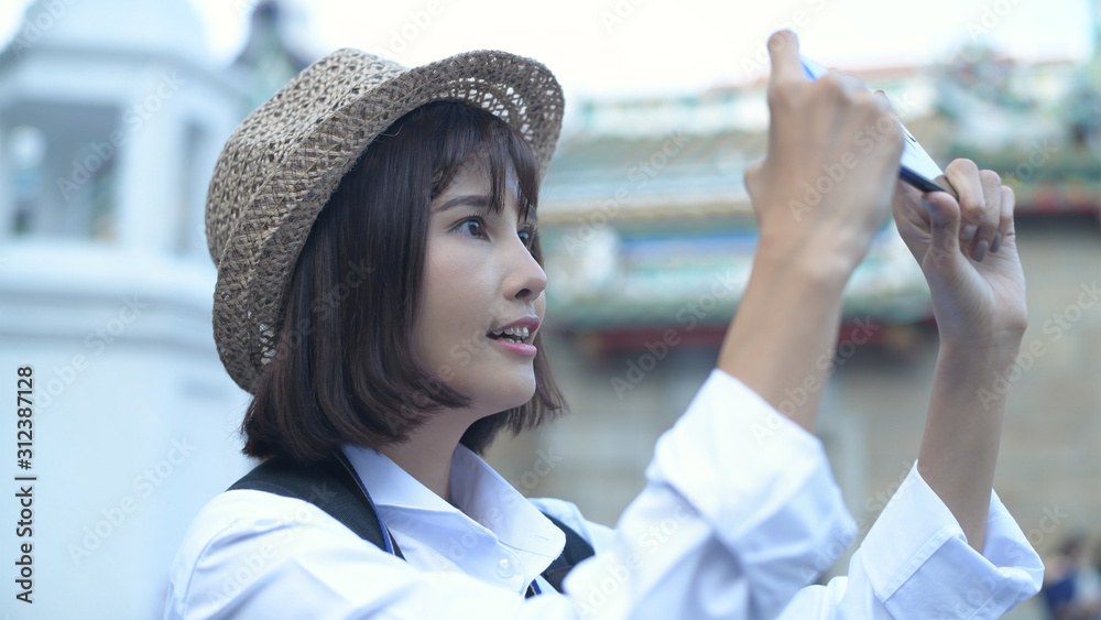 Travel concept. A beautiful girl is enjoying taking pictures in the city. 4k Resolution. Travel concept. A beautiful girl is enjoying taking pictures in the city. 4k Resolution.