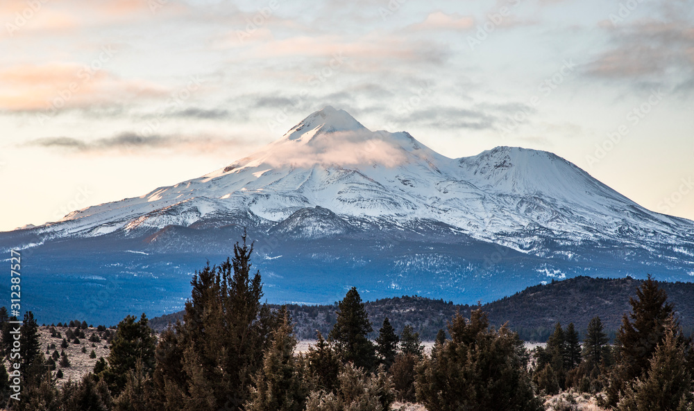 Mount Shasta with snow  on cold morning 
