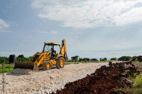 Tractor Working On Road Landscape In Jamaica