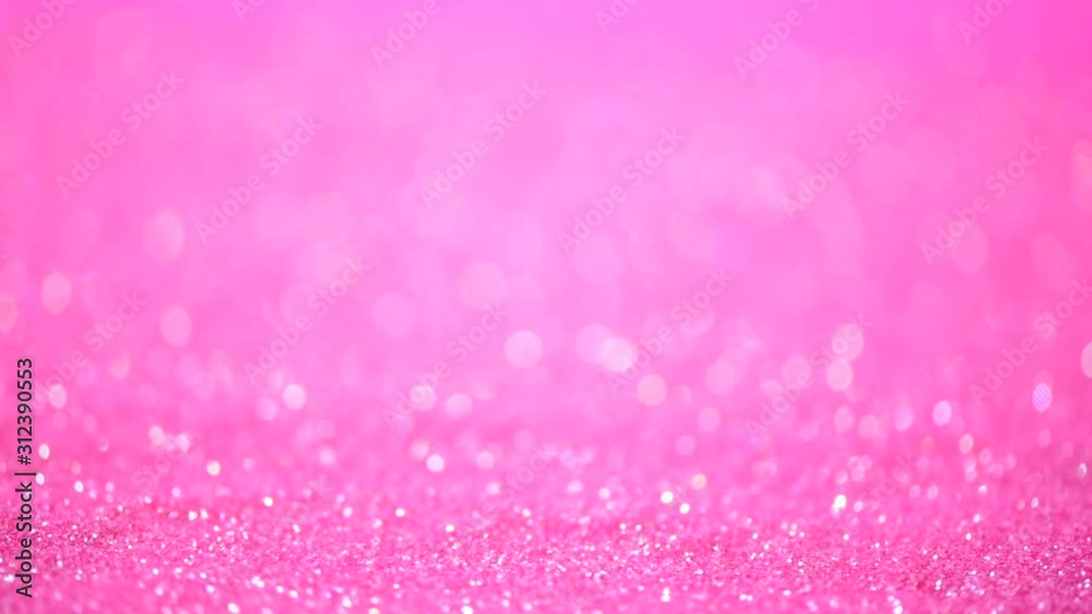 Festive pink background. Abstract sparkling lights, shiny holiday background