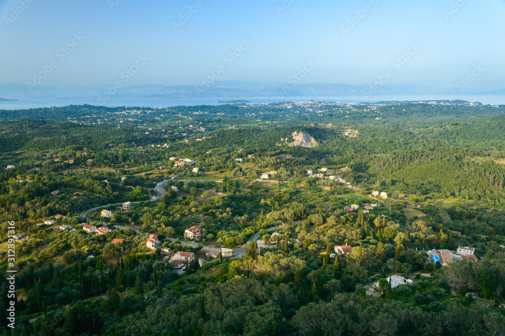 Corfu, a small town built in the mountains between the trees, panorama from the Kaiser throne vantage point.