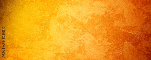 Fototapeta Żółty pomarańczowy tło z teksturą i zakłopotany rocznika grunge i akwareli farby plamy w eleganckiej Bożenarodzeniowej tło ilustraci