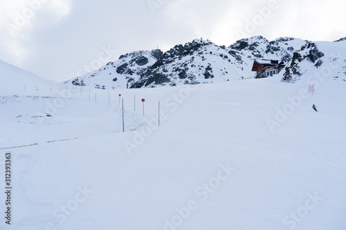 ski slope with a wooden hut