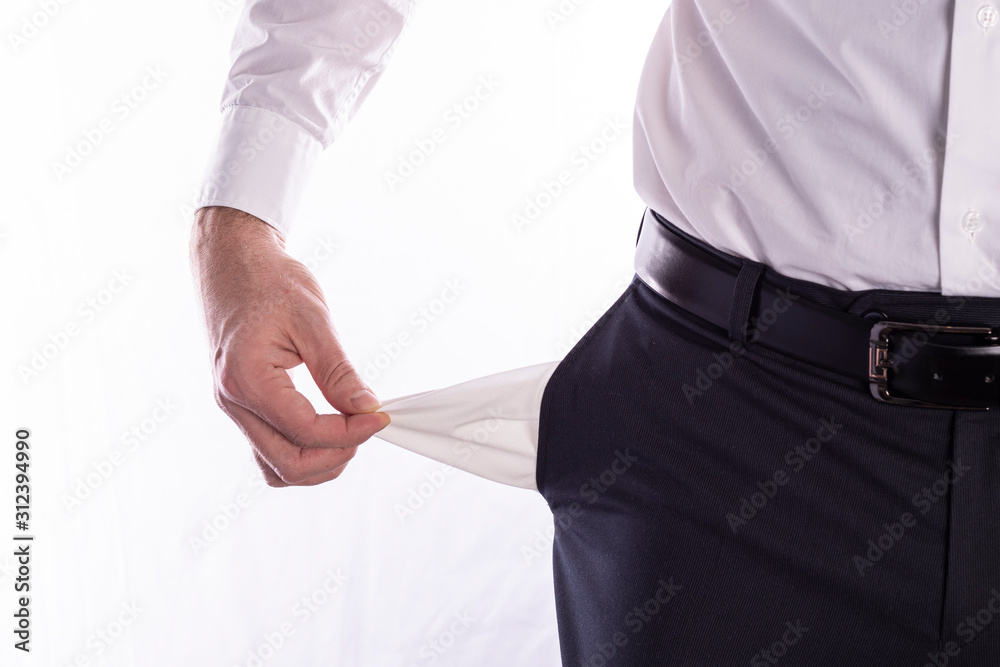 Businessman with empty pockets, man's hands are holding empty pockets of trousers on a white background with space for text Businessman with empty pockets, man's hands are holding empty pockets of trousers on a white background with space for text