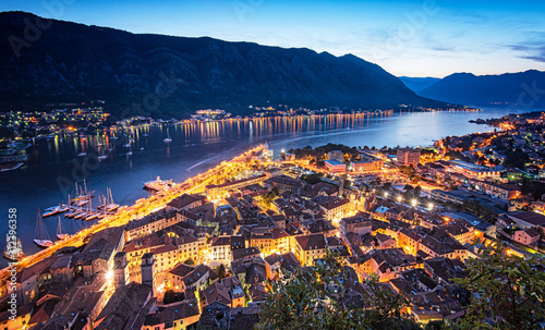 View on Kotor Bay with the medieval castle and with ships at night