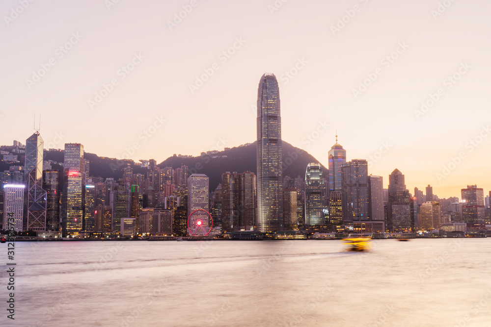 Obraz premium Panorama of Victoria harbor of Hong Kong city, from day to night Cold front in December.